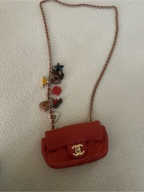 CHANEL Mini Quilted Flap Bag in Coral Red with Gold Hardware